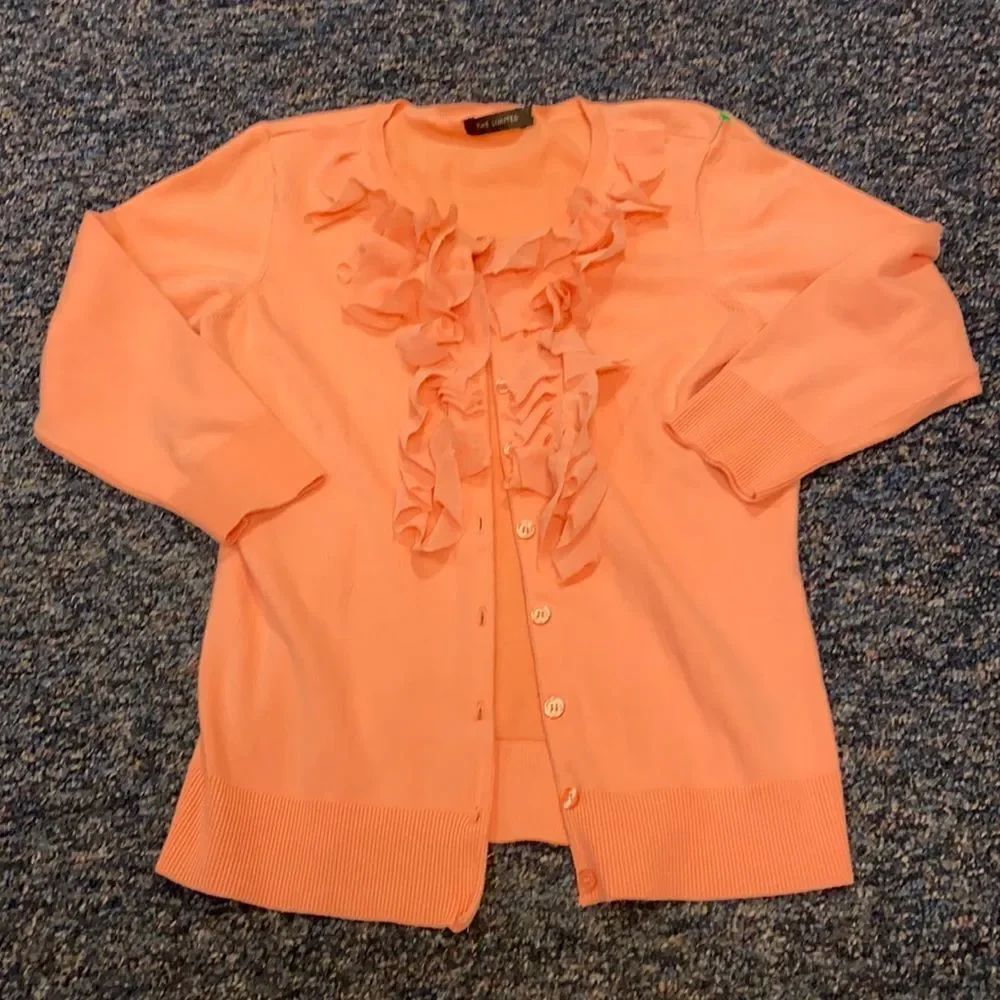 The limited salmon colored Ruffle button down sz.S